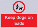 dogs-on-lead-symbol-with-black-text-on-white-background~
